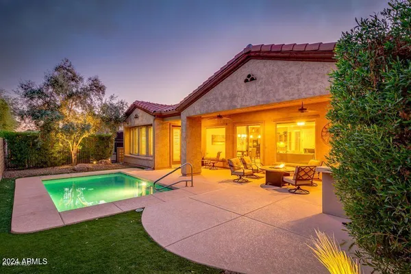 a view of a backyard with sitting area