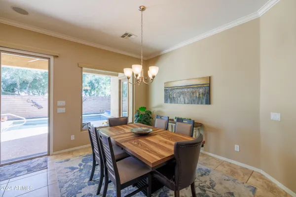 a dining room with furniture and window