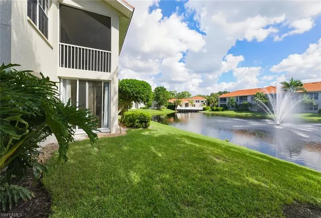 a front view of a house with garden and patio