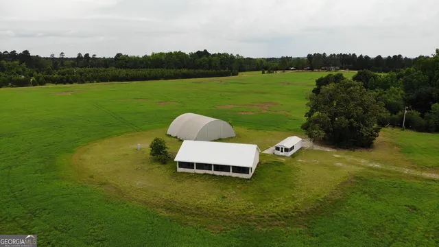 a wooden bench sitting in the middle of a lake