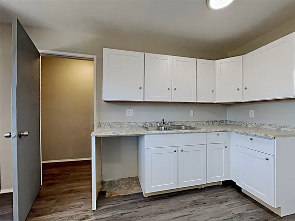 a view of cabinets with wooden floor