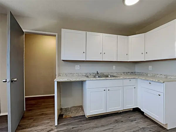 a view of cabinets with wooden floor