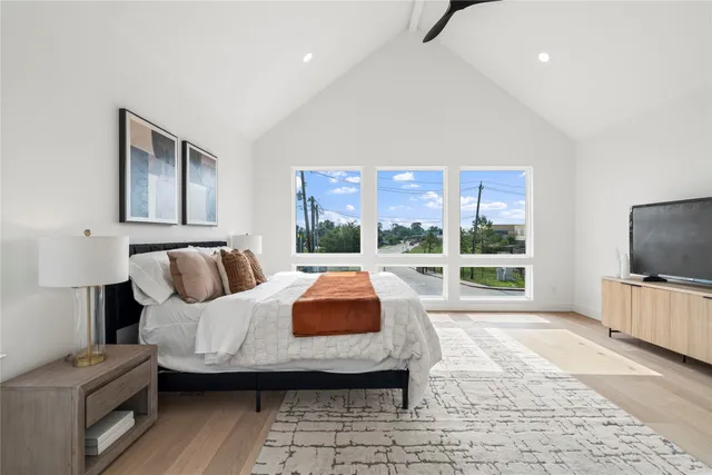 a view of a room with wooden floor and a window