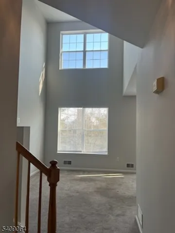 a view of empty room with windows