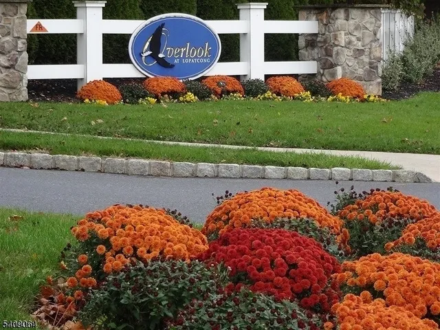 a view of a swimming pool and a yard