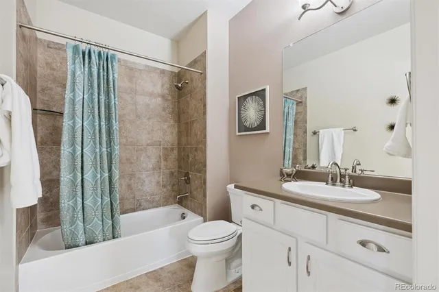 a view of a kitchen with refrigerator and cabinet