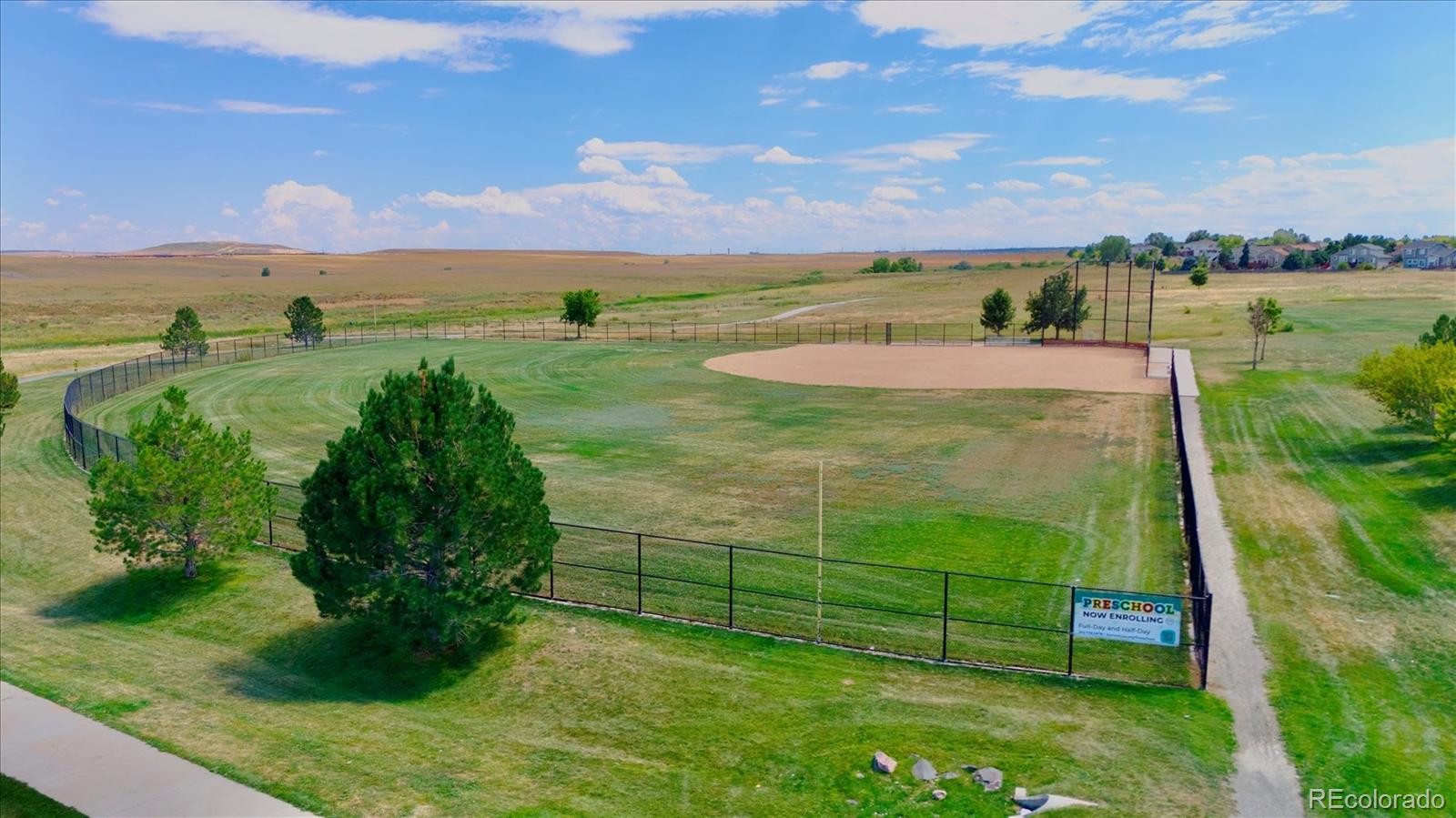 2028 South Flanders Way, Unit A Aurora, CO 80013 - Photo 21 of 30 a view of a garden with a building in the background