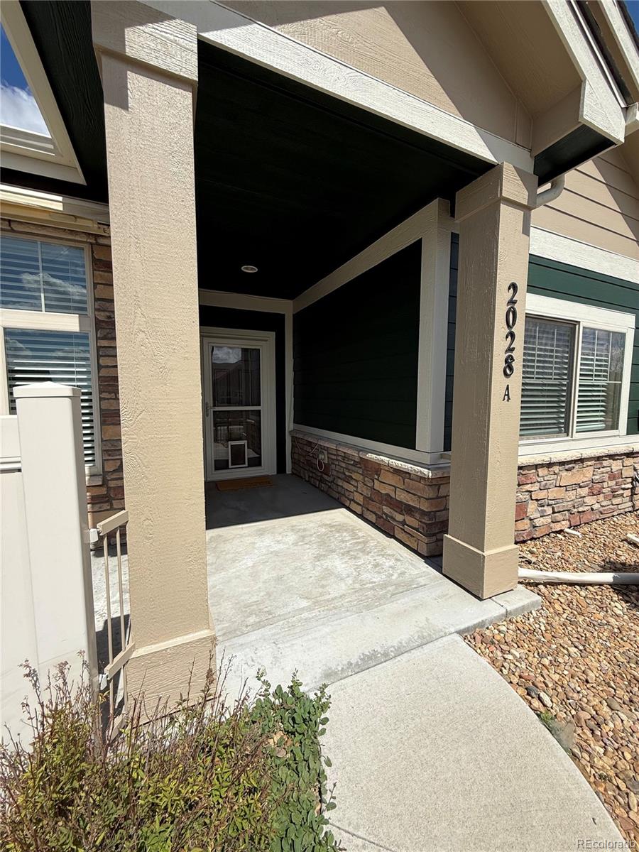 2028 South Flanders Way, Unit A Aurora, CO 80013 - Photo 25 of 30 a front view of a house with shower