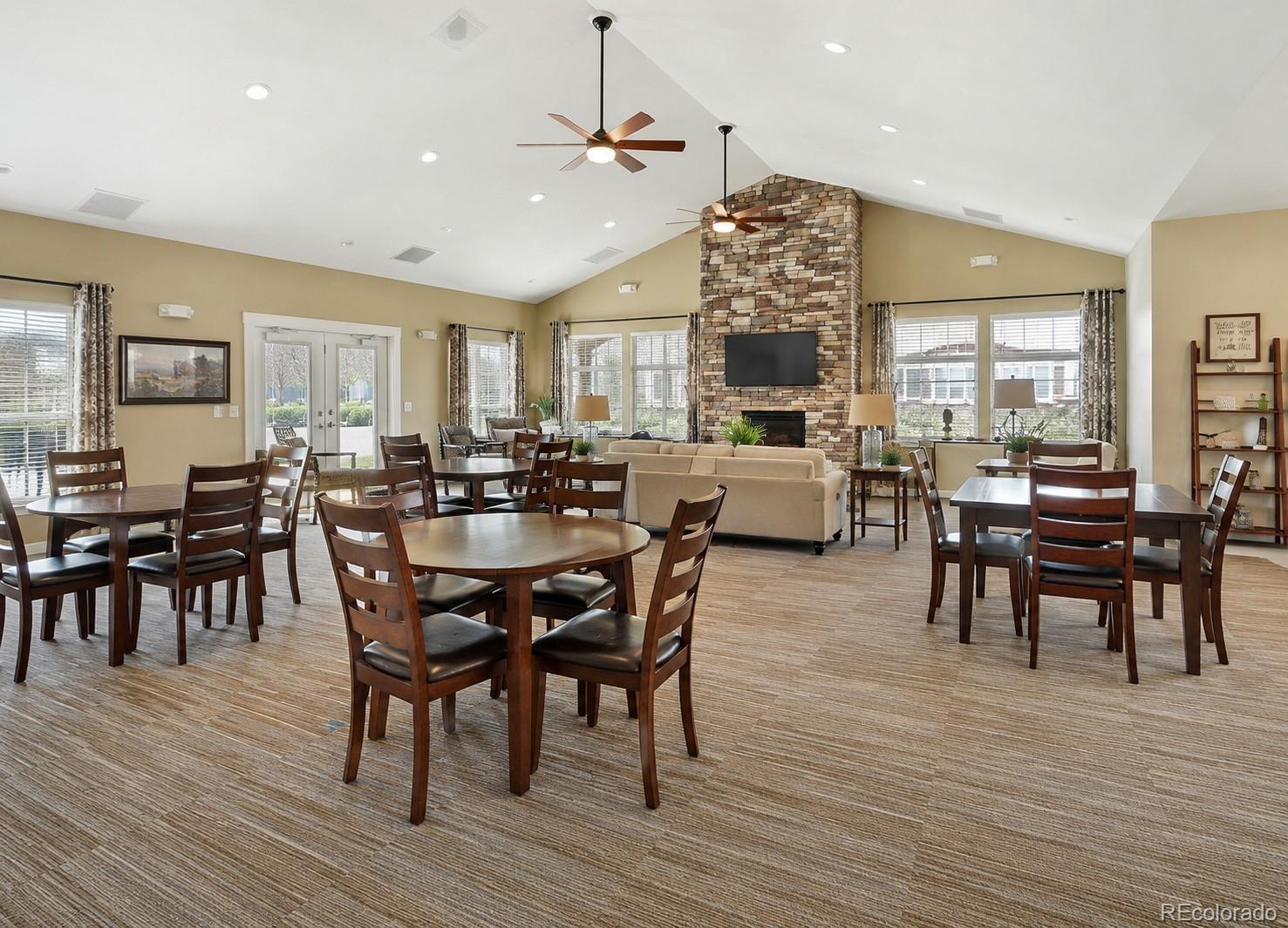 2028 South Flanders Way, Unit A Aurora, CO 80013 - Photo 27 of 30 a view of a dining room with furniture window and wooden floor