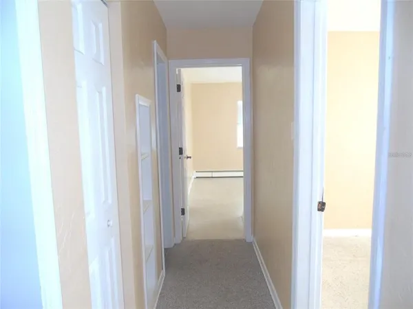 a view of a bathroom from a hallway