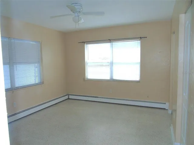 an empty room with a bathroom