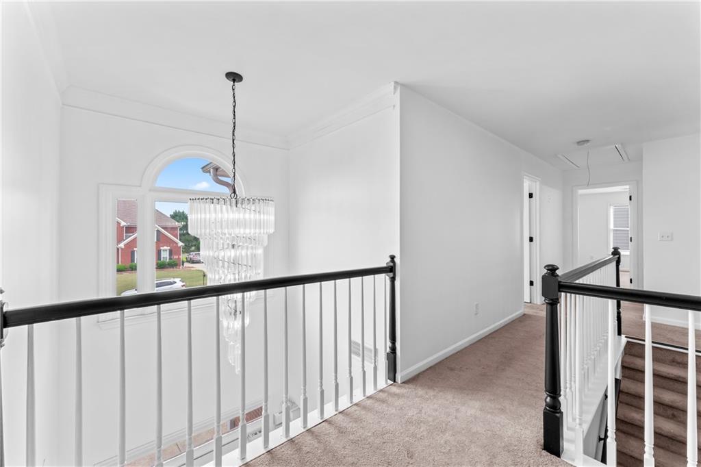 4267 Azalea Walk Ellenwood, GA 30294 - Photo 12 of 24 a view of a hallway with a dining table
