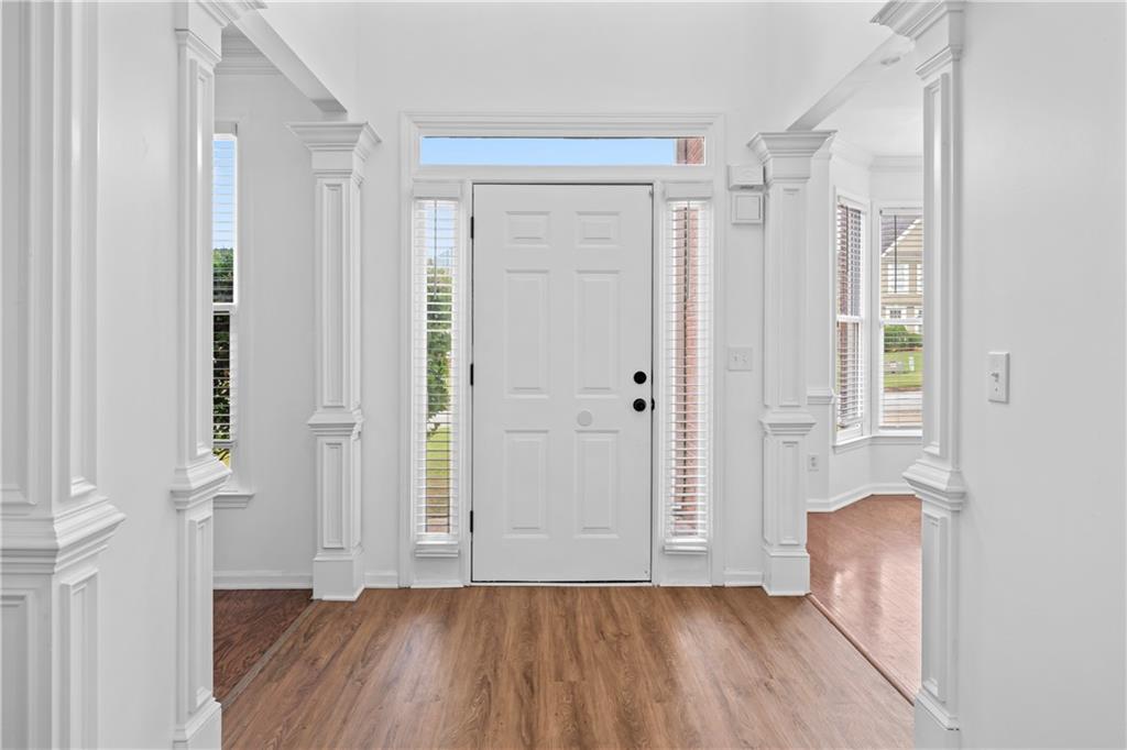 4267 Azalea Walk Ellenwood, GA 30294 - Photo 2 of 24 an empty room with wooden floor and a window