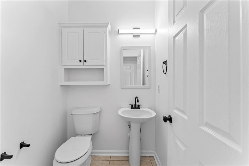 4267 Azalea Walk Ellenwood, GA 30294 - Photo 5 of 24 a bathroom with a sink a toilet and shower