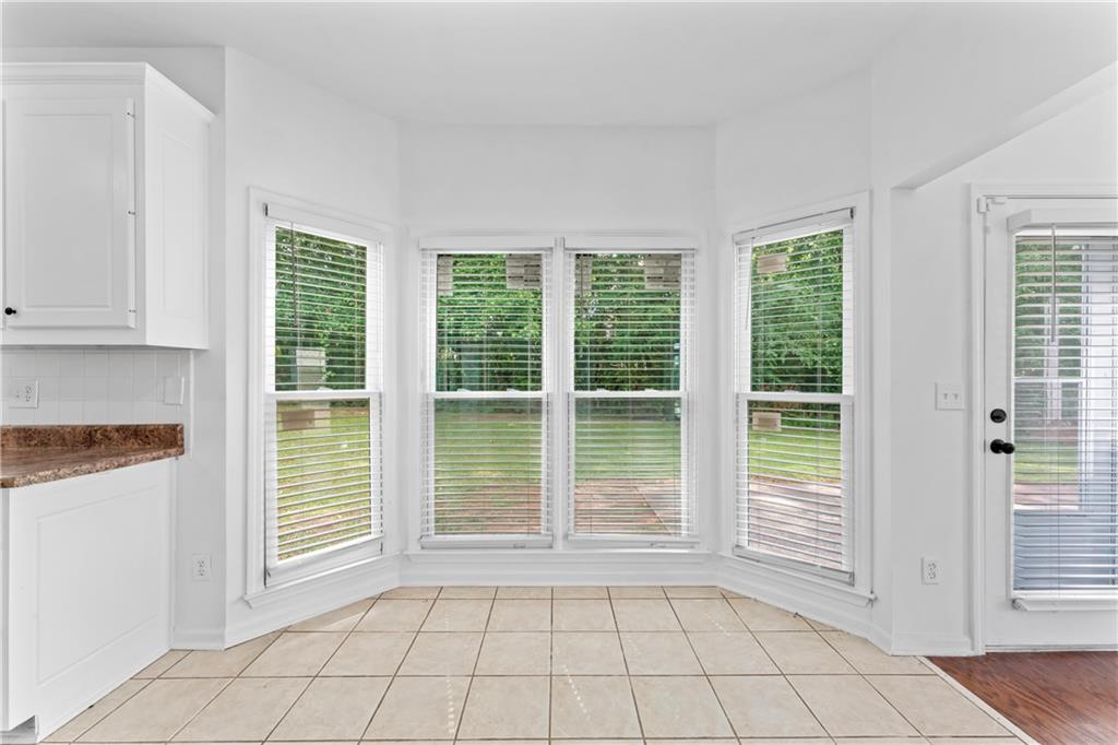 4267 Azalea Walk Ellenwood, GA 30294 - Photo 8 of 24 a view of an empty room with windows