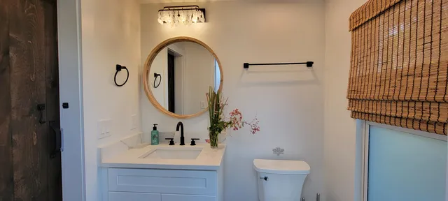 a bathroom with a sink and a mirror