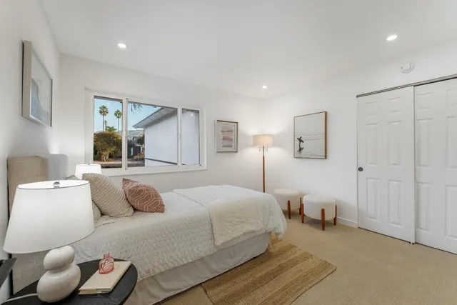 a bedroom with a bed and window