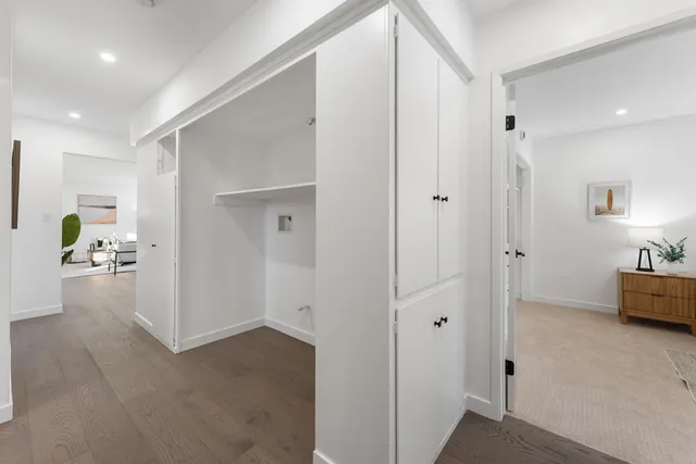 a view of a bathroom with tub shower and bedroom