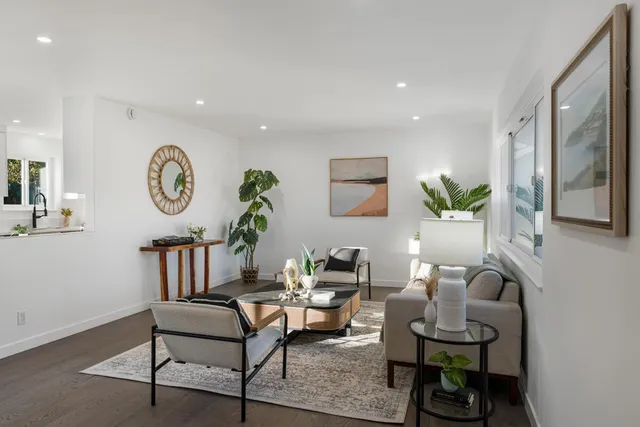 a living room with furniture and a clock