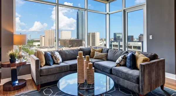 a living room with furniture and a large window