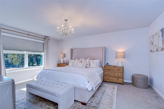 a bedroom with bed and window