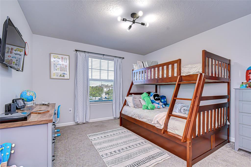 11724 Wrought Pine Loop Riverview, FL 33569 - Photo 25 of 44 a bedroom with furniture and a window