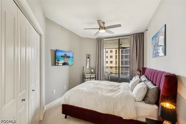 a view of a living room and a balcony