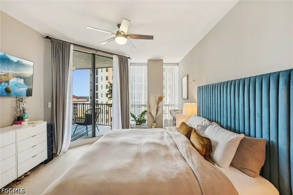 a view of ocean with boats and trees in the background