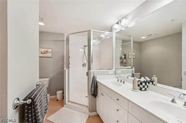 a view of a balcony with dining table and chairs with ocean view