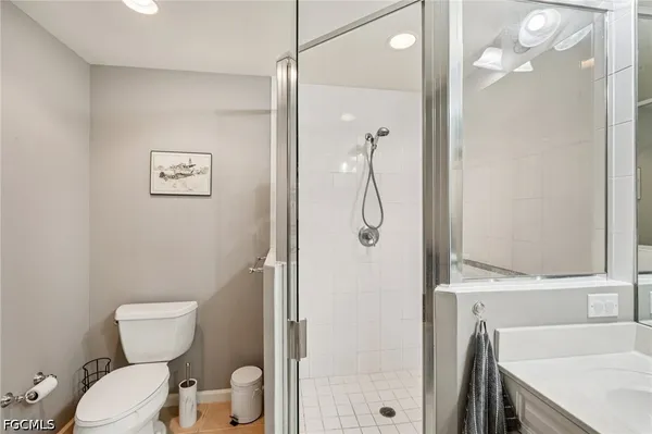 a large building with a large pool and a yard in the background