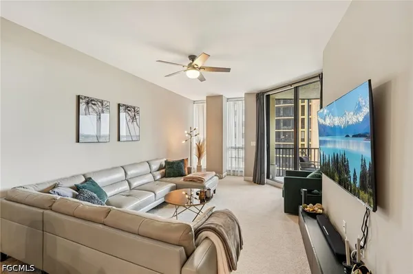 a kitchen with stainless steel appliances granite countertop a refrigerator a stove and a sink