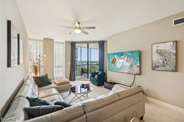 a kitchen with sink refrigerator and cabinets