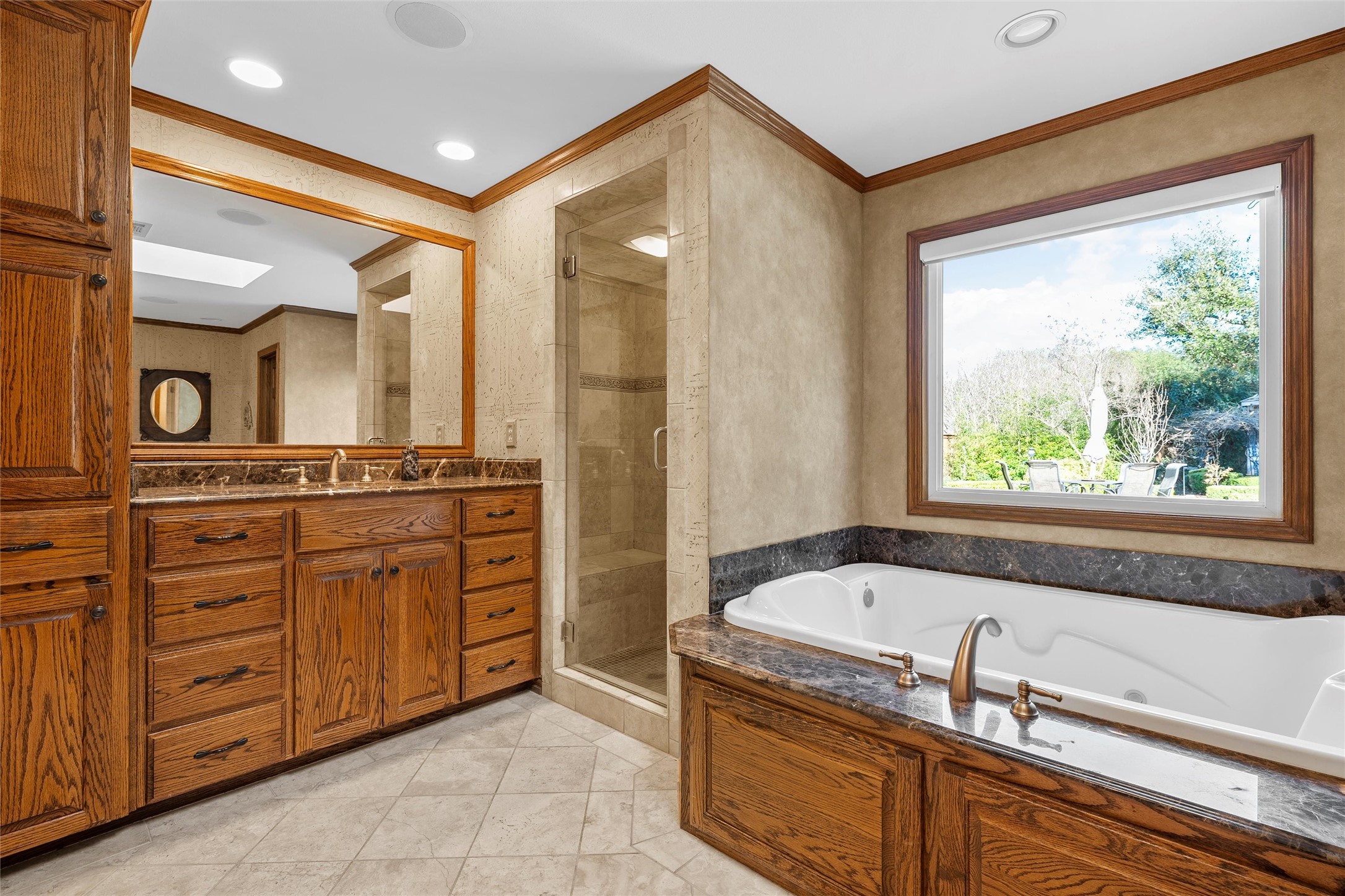 3740 Chimney Ridge Drive Waco, TX 76708 - Photo 18 of 50 a bathroom with a tub sink and mirror