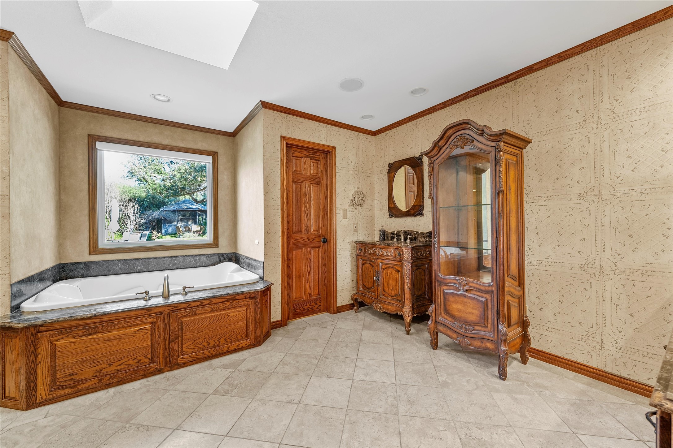 3740 Chimney Ridge Drive Waco, TX 76708 - Photo 19 of 50 a spacious bathroom with a tub a sink and mirror