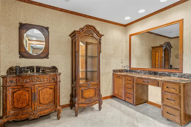a bathroom with a sink a mirror and a cabinets