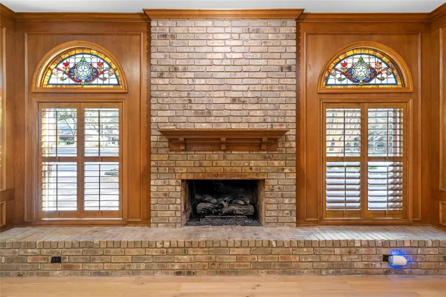 an entrance to house with wooden floor