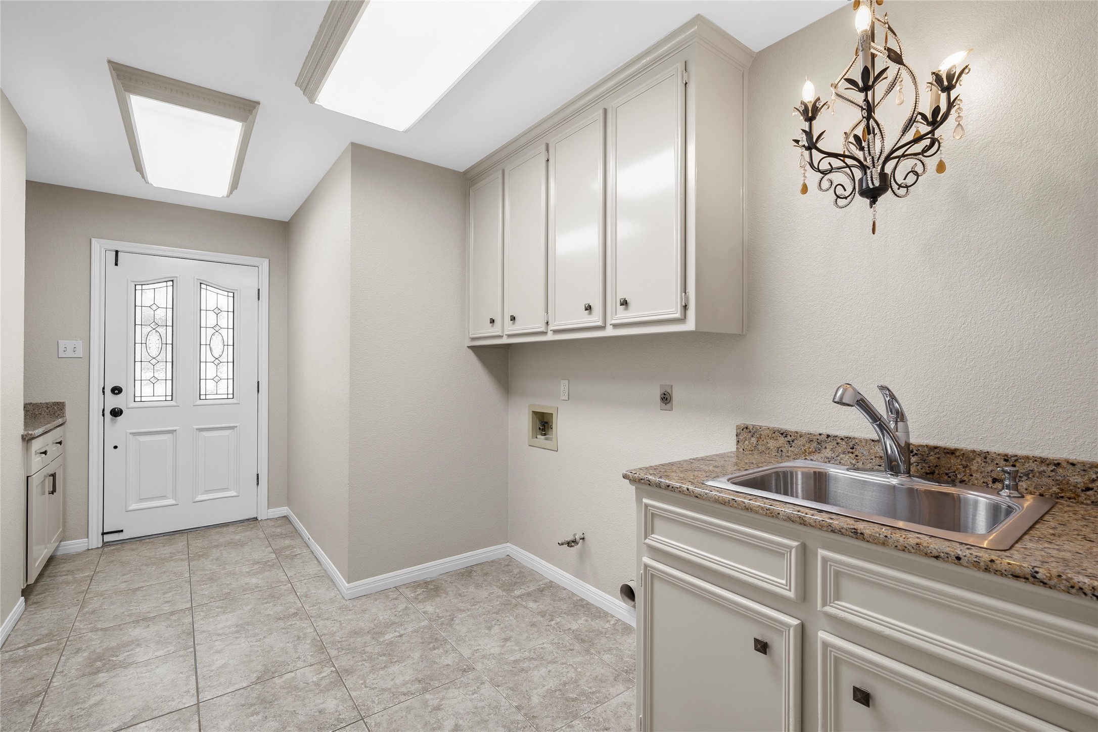 3740 Chimney Ridge Drive Waco, TX 76708 - Photo 26 of 45 a kitchen with a sink and cabinets