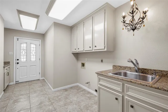 a kitchen with a sink and cabinets