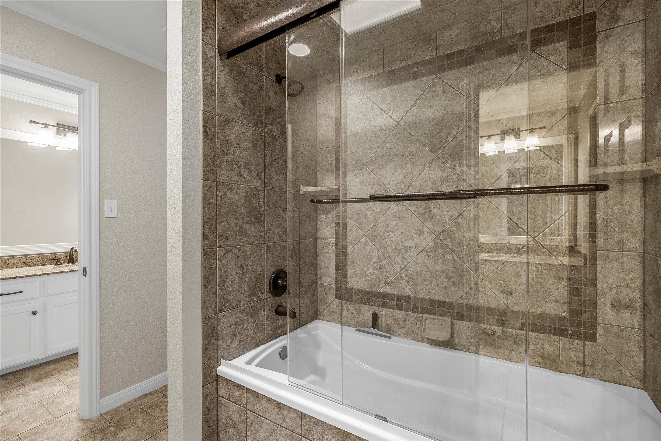 3740 Chimney Ridge Drive Waco, TX 76708 - Photo 34 of 50 a bathroom with a bathtub and shower
