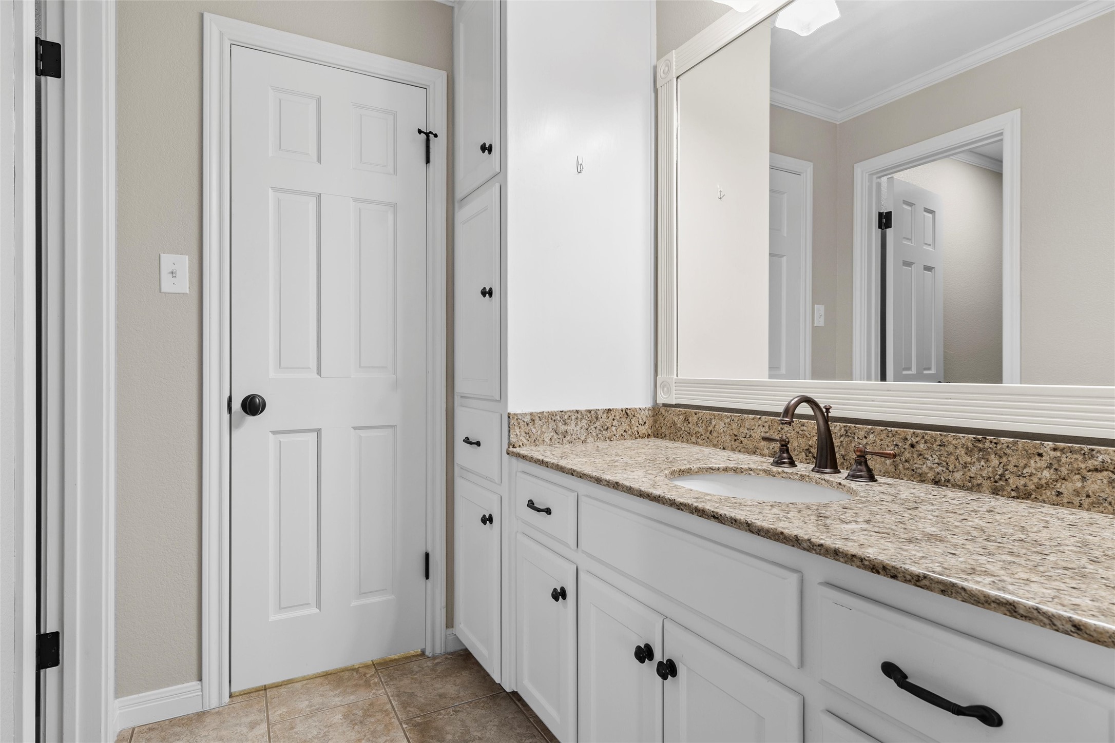 3740 Chimney Ridge Drive Waco, TX 76708 - Photo 35 of 50 a bathroom with a granite countertop sink and a mirror