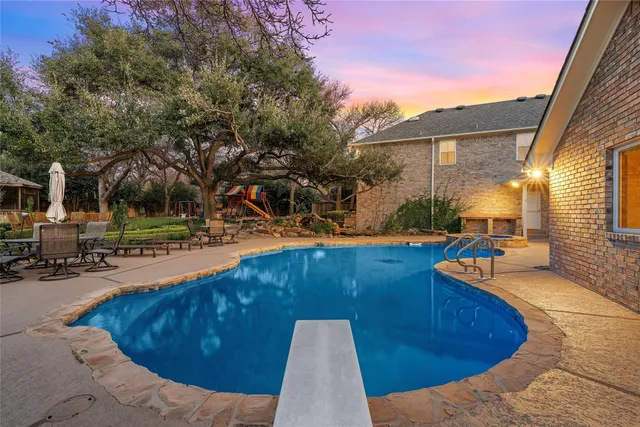 a view of a swimming pool with a lounge chair