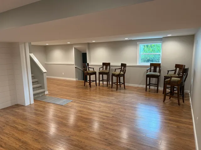 a view of a dining room with furniture and wooden floor