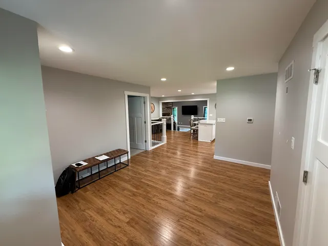 a view of a living room a room with wooden floor