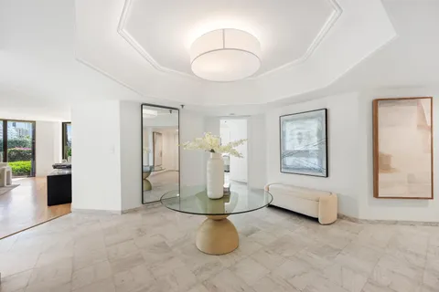 a view of a livingroom with furniture and a chandelier