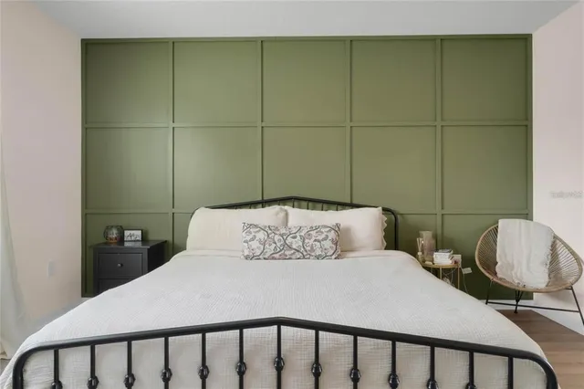 a bedroom with a bed and cabinets