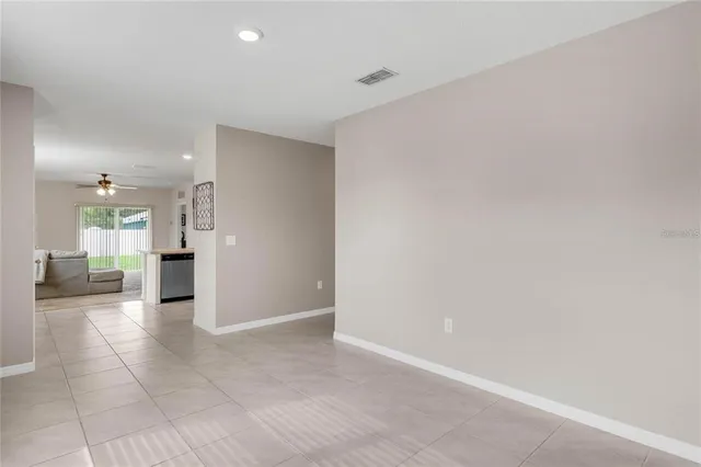 a view of a hallway with a kitchen
