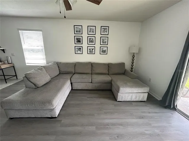 a living room with furniture and a window