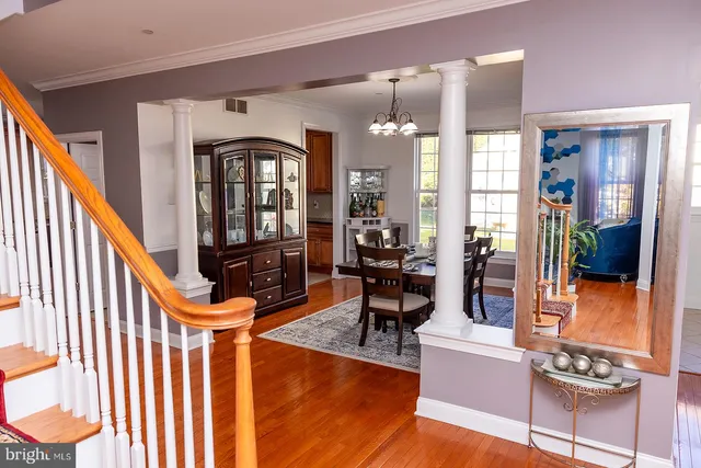 a living room with furniture a rug and a large window
