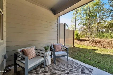 a view of yard with patio