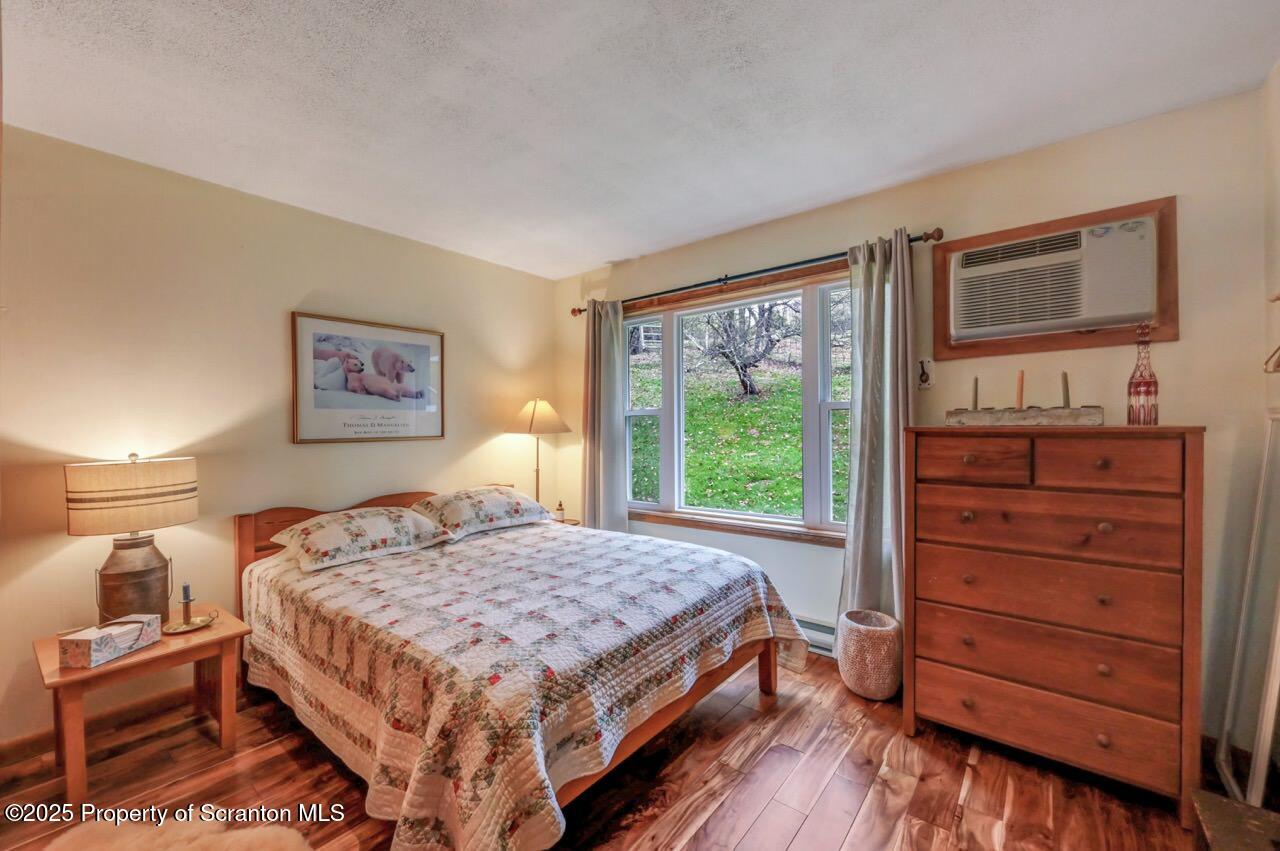 242 Shore Drive Hop Bottom, PA 18824 - Photo 35 of 120 a bedroom with a bed and a dresser